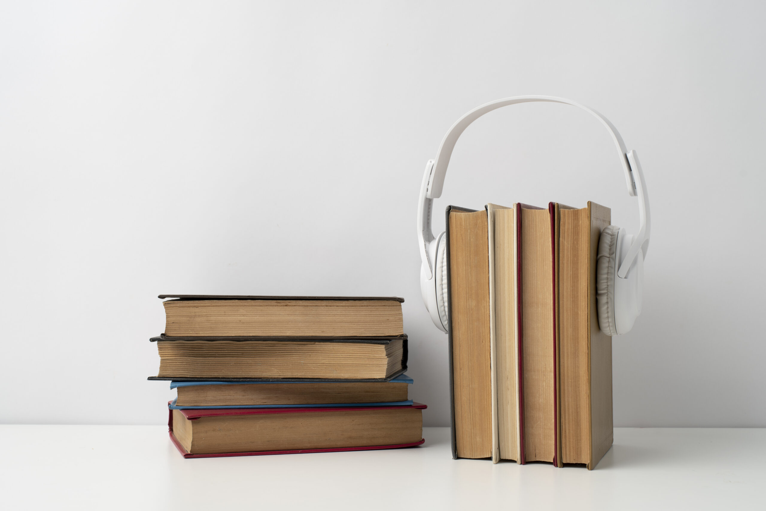 books-stack-with-headphones-arrangement