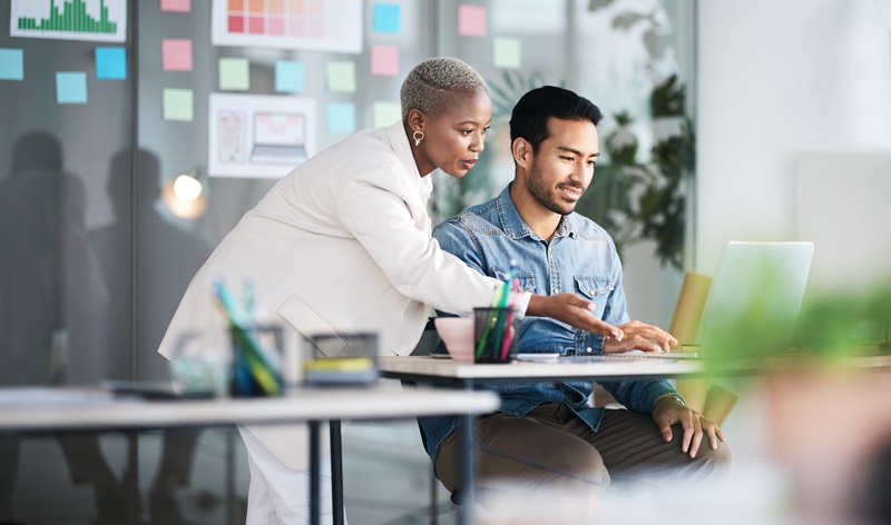 Office laptop, diversity and business people reading online report, website design feedback or research project. Collaboration, staff mentor and team designer working on company homepage development