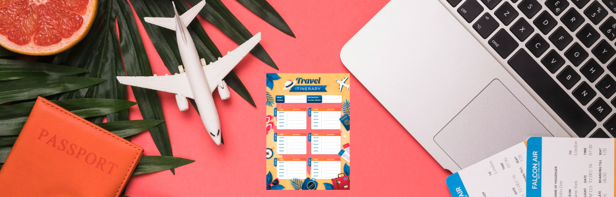 A laptop on a table with itinerary templates next to an airplane and other items.