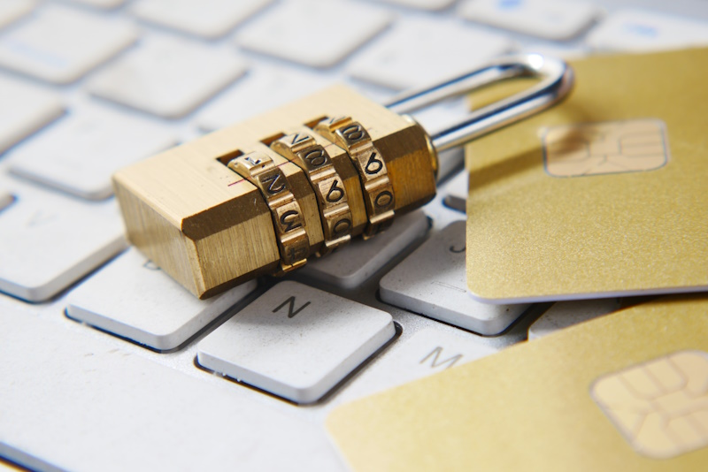 A padlock lying on keyboard to represent identity theft