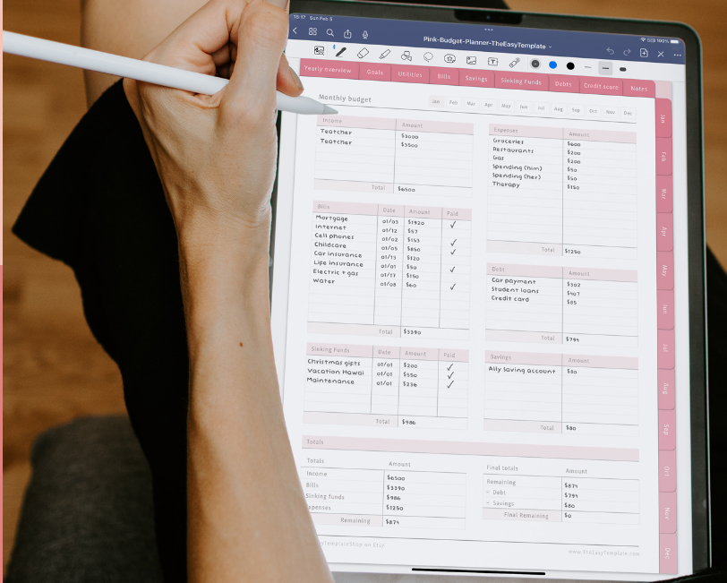 A woman is holding an ipad with a planner on it.