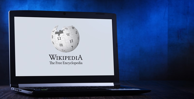 Laptop computer displaying logo of Wikipedia