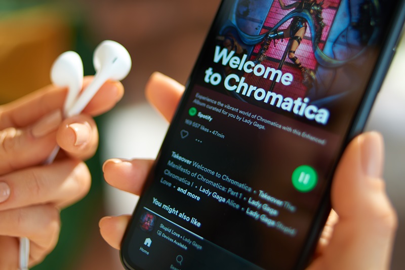 smartphone with Lady Gaga album Chromatica playing on Spotify