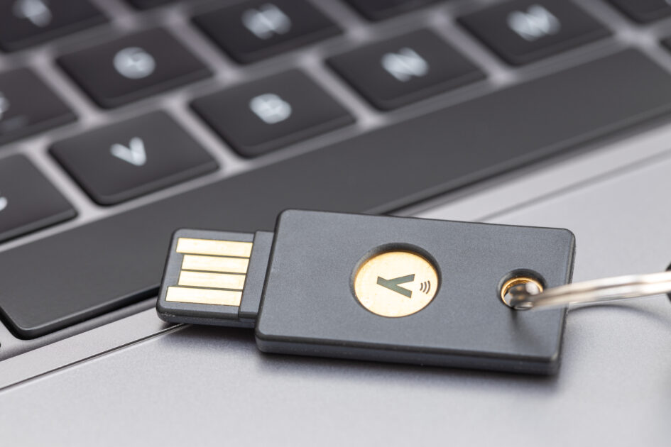 Galicia, Spain; April 1, 2022: Yubikey hardware key on laptop. Yubikey is a hardware authentication device manufactured by Yubico