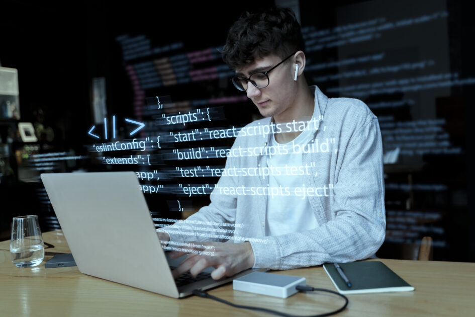 programming-background-with-person-working-with-codes-computer-1