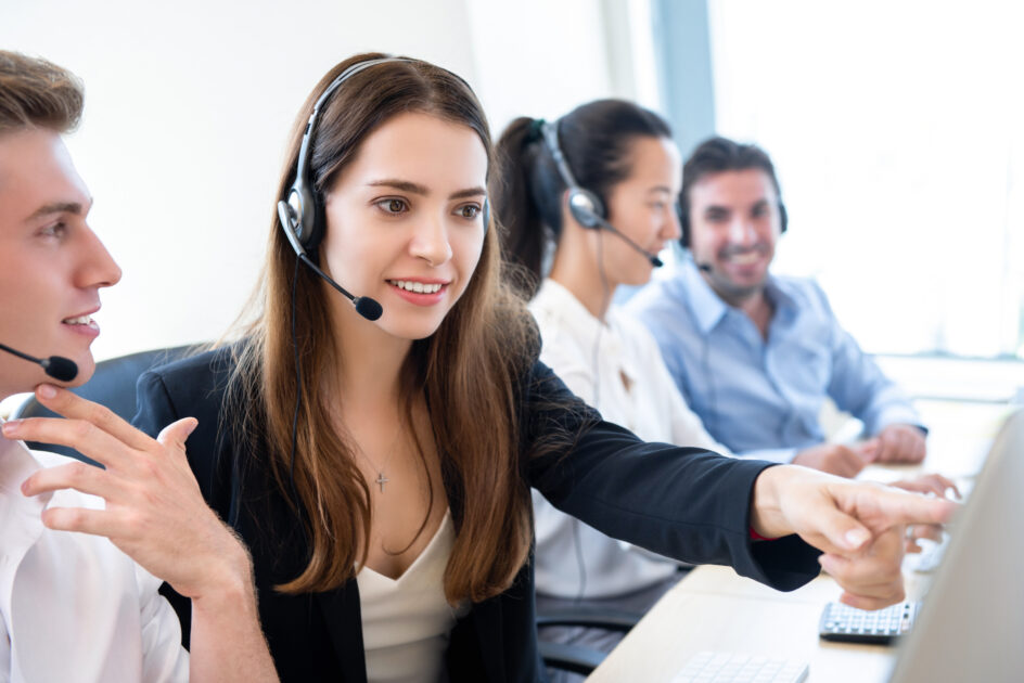 Businesswoman telemarketing staff working with coworker in call