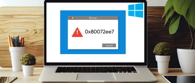 A laptop displaying a Windows 10 error message with Error 0x80072ee7.