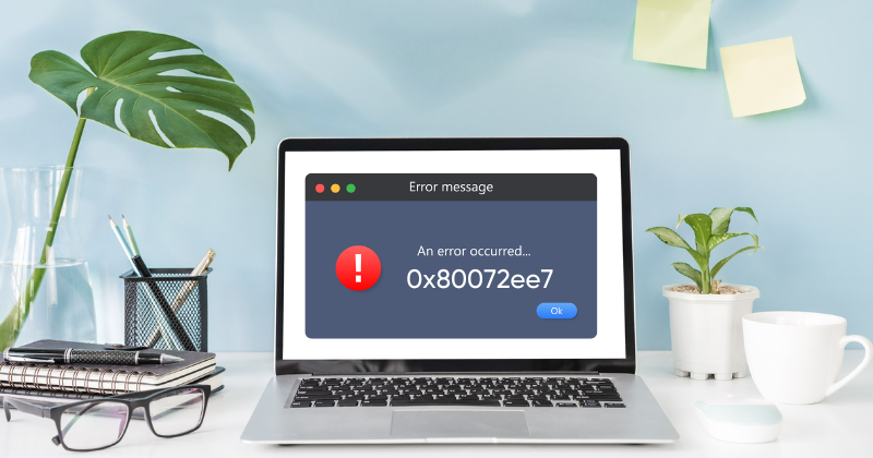 A laptop screen displaying error message "Error 0x80072ee7".