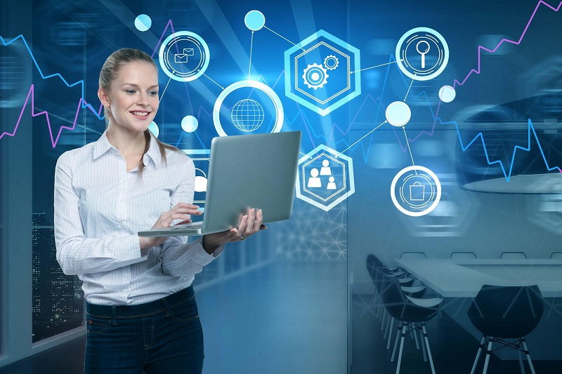 A woman holding a laptop in front of business icons.