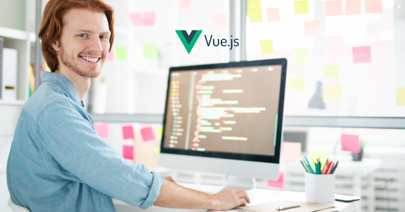 A man sitting in front of a computer with a veejs logo.