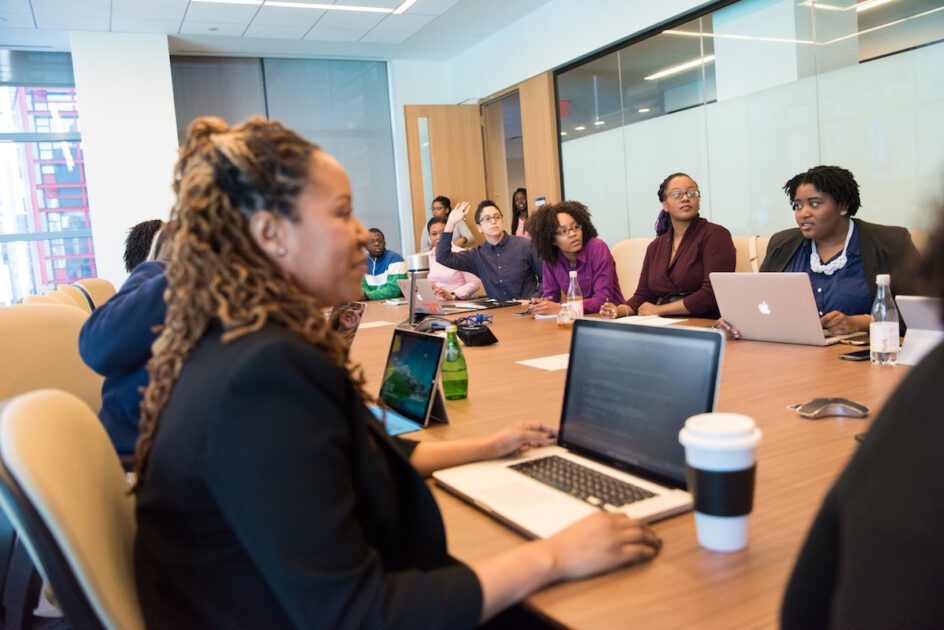 Employees Sitting in a Meeting Room