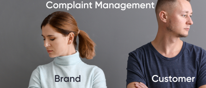 A man and woman utilizing complaint management systems to enhance their brand.
