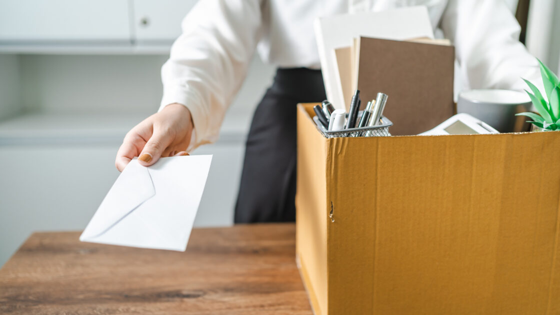 Business woman sending resignation letter and packing Stuff Resi