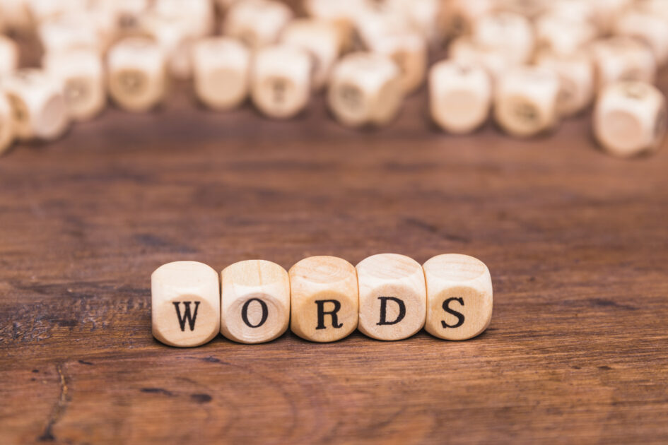 word-text-wooden-dices-brown-desk