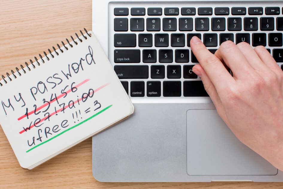 A hand typing on a keyboard