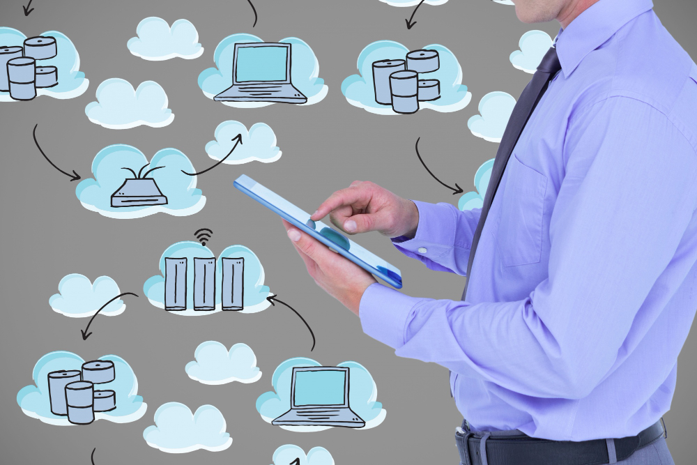 man with tablet in front of multi-cloud