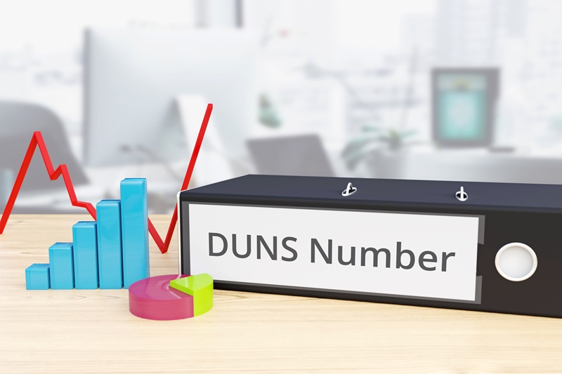 DUNS Number – Finance/Economy. Folder on desk with label beside diagrams. Business/statistics. 3d rendering